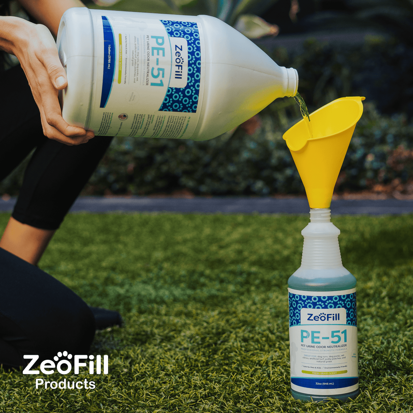 PE-51 Gallon refilling 32oz bottle, using a funnel.