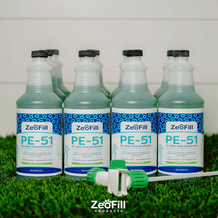 Image of 12 PE-51 32oz bottles with 1 spray nozzle laying across.
